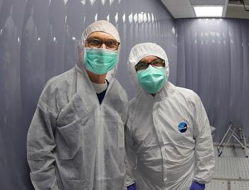 Michael Turner and Luca Grandi inside the Xenon1T detector.